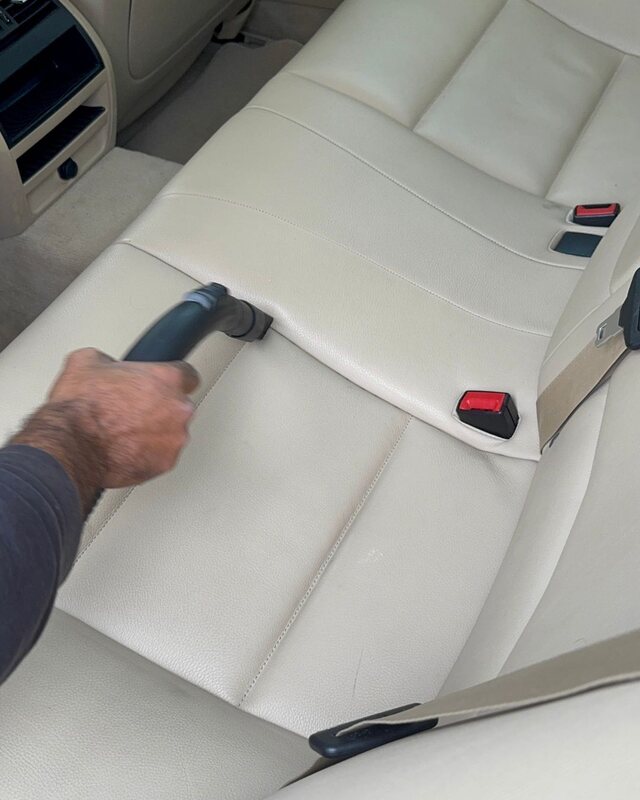 Steamit vacuuming a vehicle seat