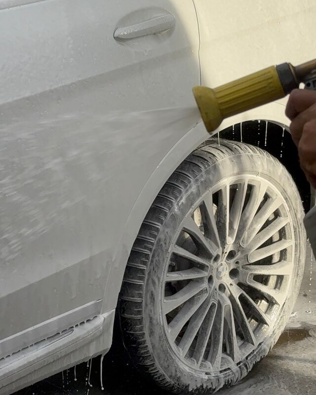 Steamit washing foam from a vehicle wheel